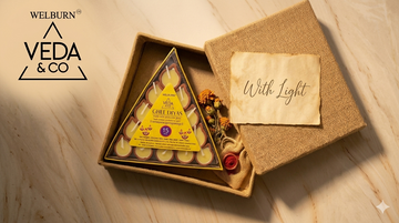 A beautifully packaged clay ghee diya gift set with dried marigolds and a handwritten card