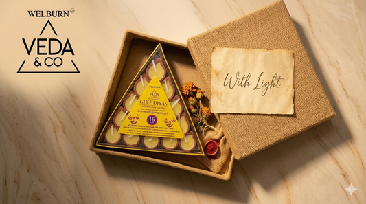 A beautifully packaged clay ghee diya gift set with dried marigolds and a handwritten card