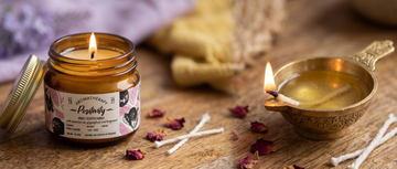 An aromatherapy candle jar burning evenly with a full melted wax pool reaching the edges of the glass