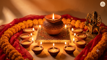 Side by side comparison of a Veda & Co clay ghee diya and a synthetic wax candle on a puja thali