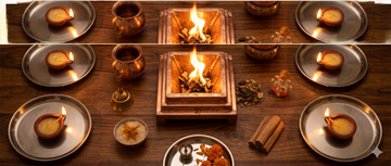 Multiple Veda & Co cow ghee diyas set up alongside a home havan preparation — Veda & Co