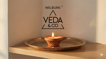 A single lit diya for pooja on a clean home altar as part of a morning routine — Veda & Co