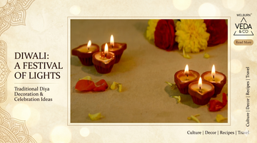 Stunning circular arrangement of lit clay ghee diyas with rose petals and marigold rangoli for Diwali pooja decoration