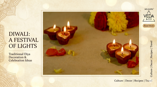 Stunning circular arrangement of lit clay ghee diyas with rose petals and marigold rangoli for Diwali pooja decoration