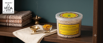 Ghee batti wicks stored in a covered container on a shaded shelf