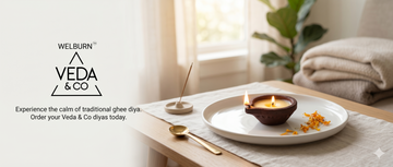 A single Veda & Co ghee diya placed on a compact apartment altar shelf — Veda & Co